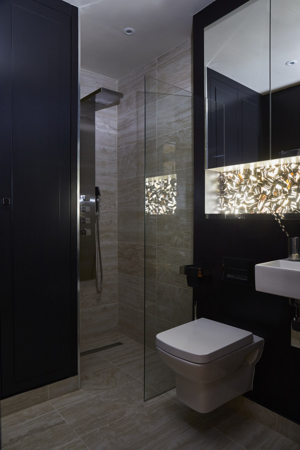 Notting Hill Story | Guest bathroom - lights off | Interior Designers